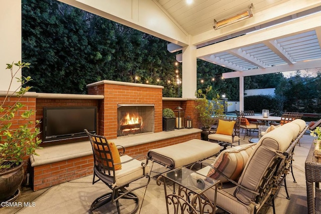 view of patio featuring an outdoor brick fireplace