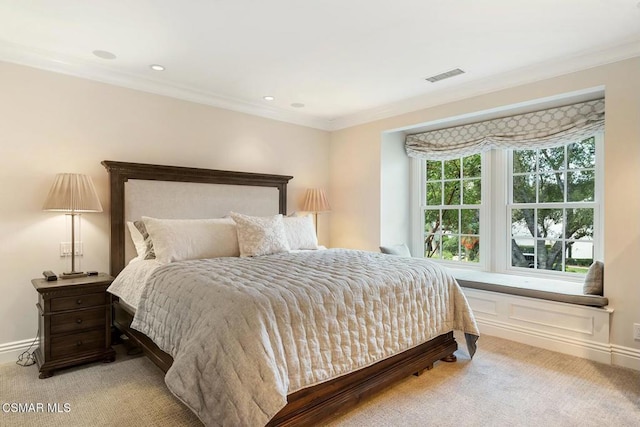 carpeted bedroom featuring crown molding