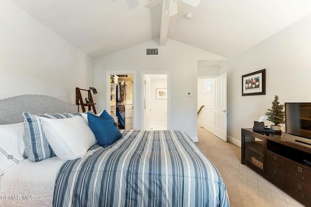 bedroom featuring ceiling fan, a walk in closet, lofted ceiling with beams, and a closet