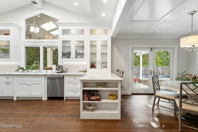 bar with pendant lighting, white cabinetry, sink, stainless steel dishwasher, and french doors