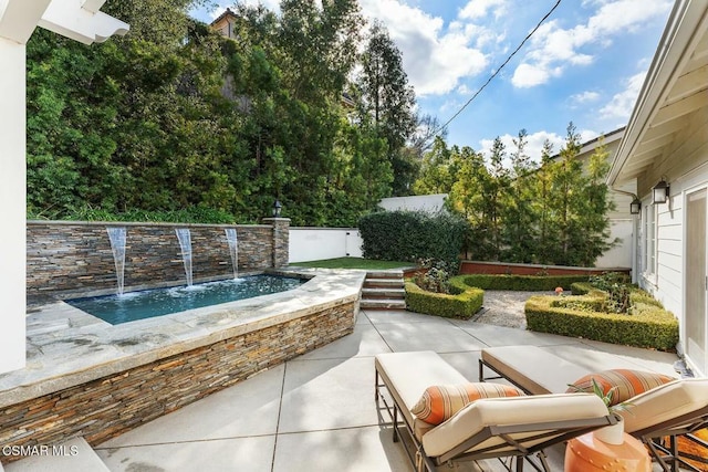 view of patio / terrace with pool water feature