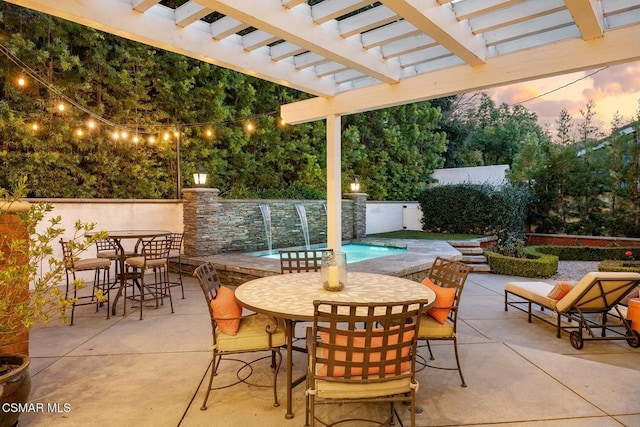 view of patio / terrace featuring a fenced in pool, pool water feature, and a pergola