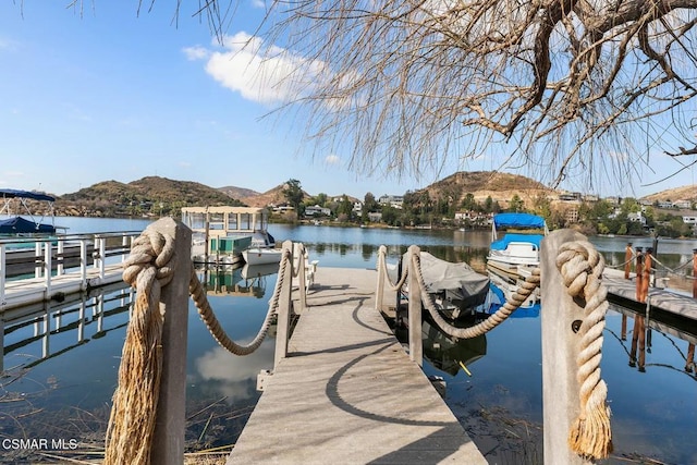 dock area with a water and mountain view