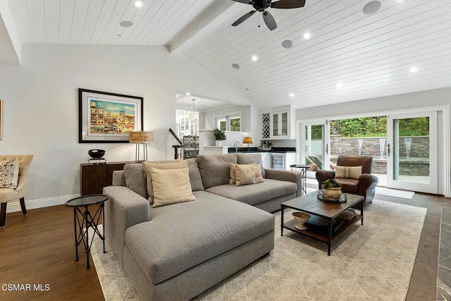 living room featuring plenty of natural light, light hardwood / wood-style floors, lofted ceiling with beams, and wooden ceiling