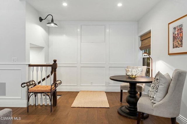 sitting room with wood-type flooring