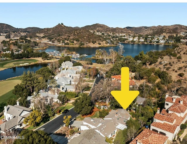 birds eye view of property featuring a water and mountain view