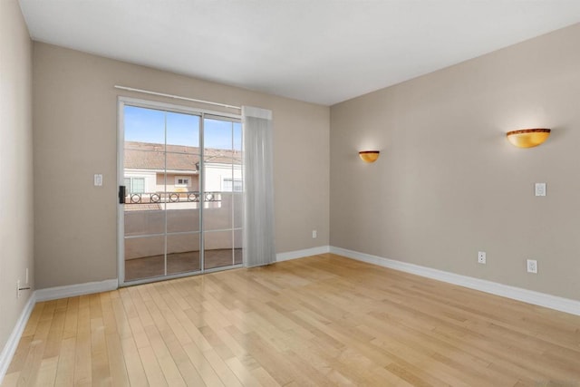 spare room with light wood-type flooring