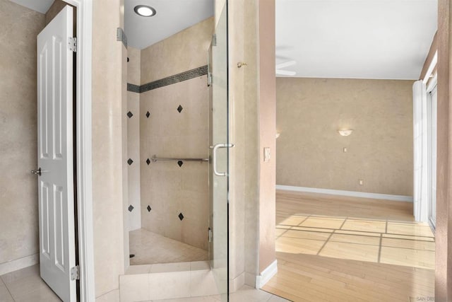 bathroom featuring tile patterned floors and a shower with door