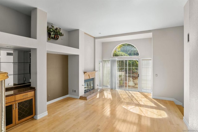 unfurnished living room with light wood-type flooring