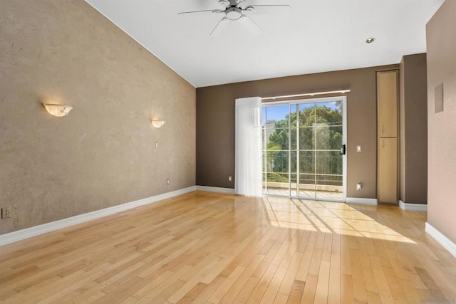 empty room featuring ceiling fan and light hardwood / wood-style floors