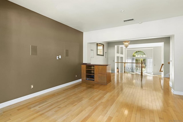 interior space featuring a notable chandelier and light hardwood / wood-style floors