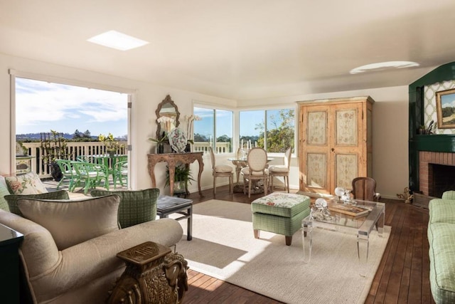 sunroom / solarium featuring a fireplace and plenty of natural light