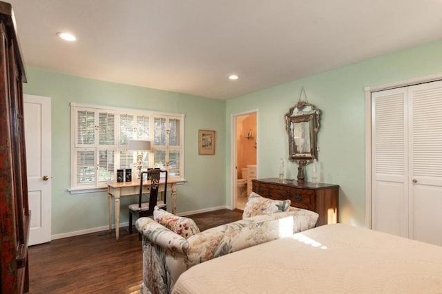 bedroom with dark hardwood / wood-style floors