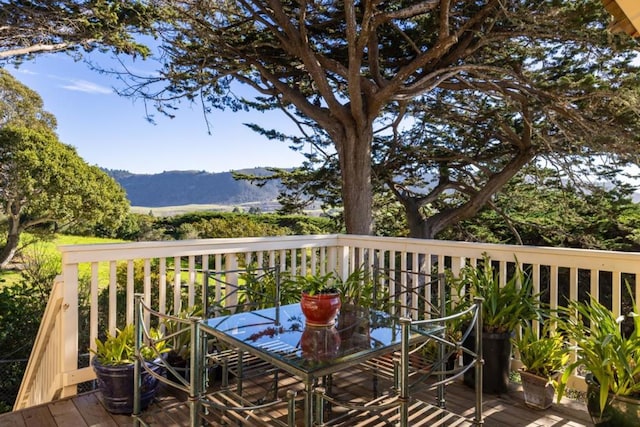 wooden terrace featuring a mountain view