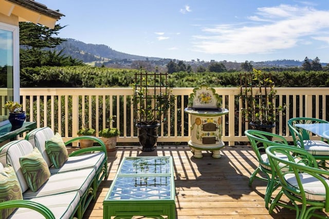 wooden terrace featuring a mountain view