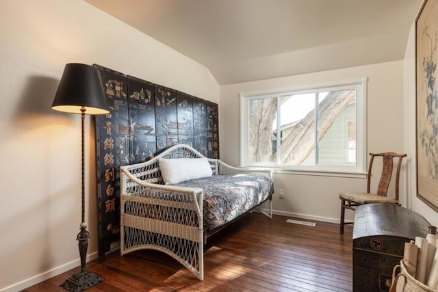 bedroom featuring vaulted ceiling and dark hardwood / wood-style floors