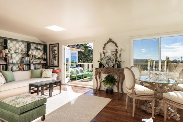 sunroom featuring vaulted ceiling