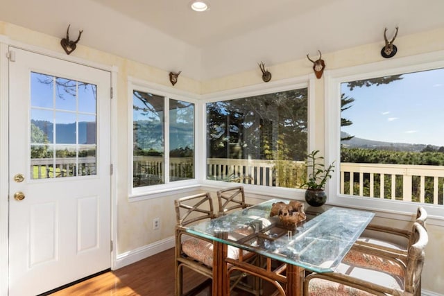 sunroom / solarium with a mountain view