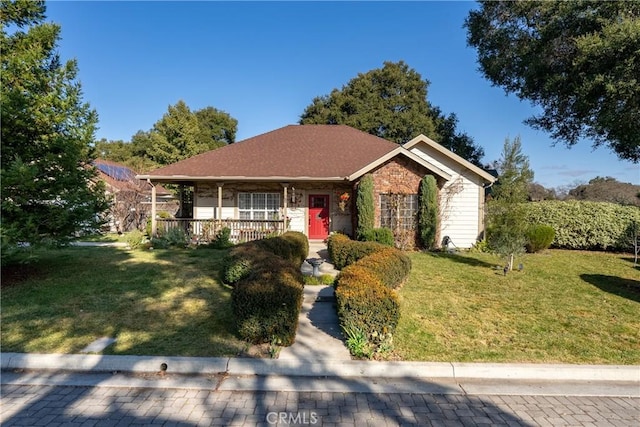 single story home with a front lawn and covered porch