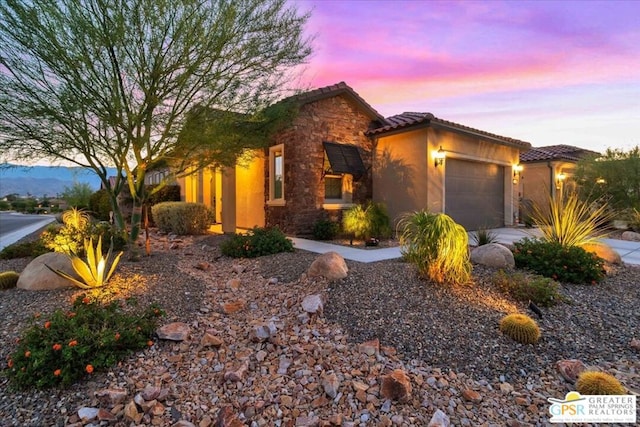 view of front of property featuring a garage