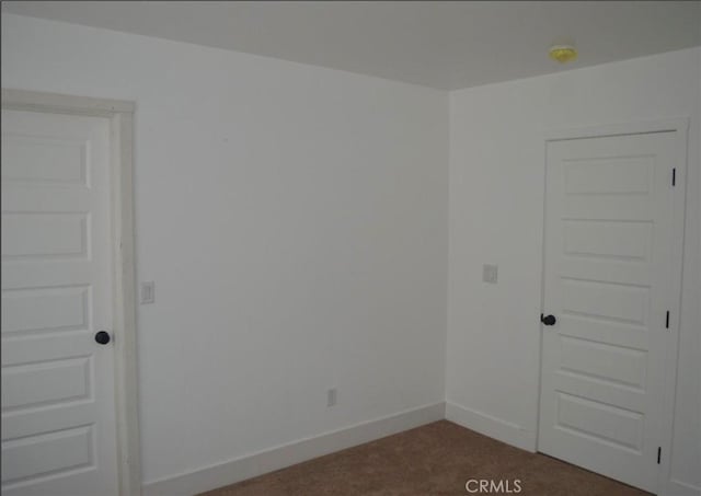 empty room featuring carpet floors