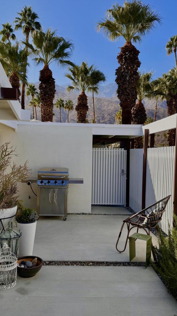 view of patio / terrace with a grill and a mountain view