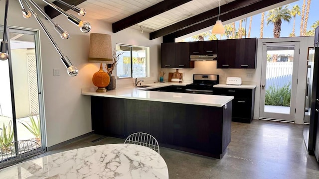 kitchen with dark brown cabinetry, sink, stainless steel range, kitchen peninsula, and pendant lighting