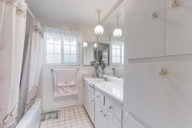 bathroom featuring shower / tub combo, vanity, and tile patterned flooring