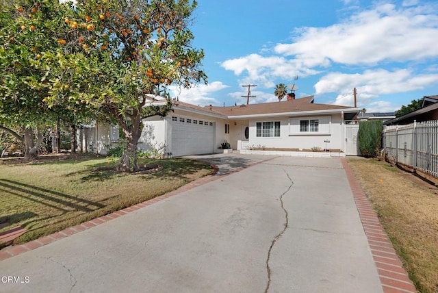 view of front of home featuring a garage and a front yard