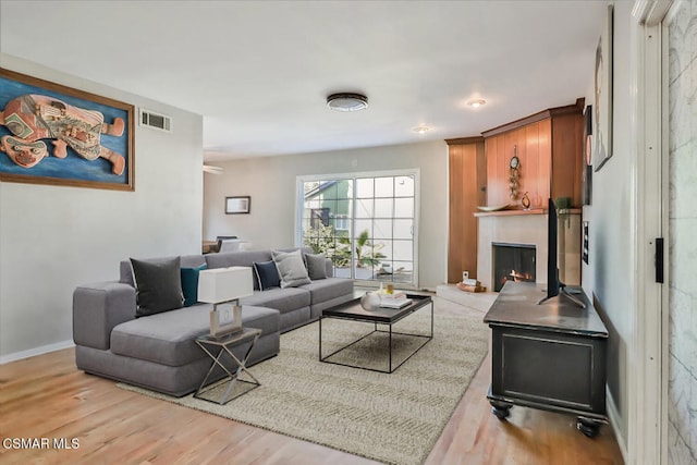 living room with light hardwood / wood-style flooring