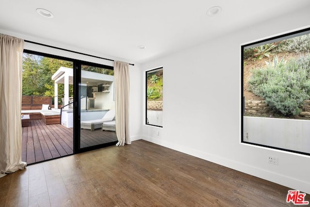 spare room featuring hardwood / wood-style floors