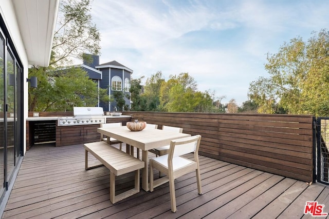 wooden deck with area for grilling and grilling area