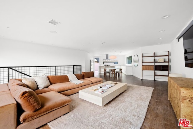 living room with dark hardwood / wood-style floors