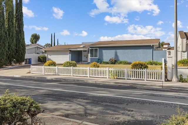 single story home featuring a garage