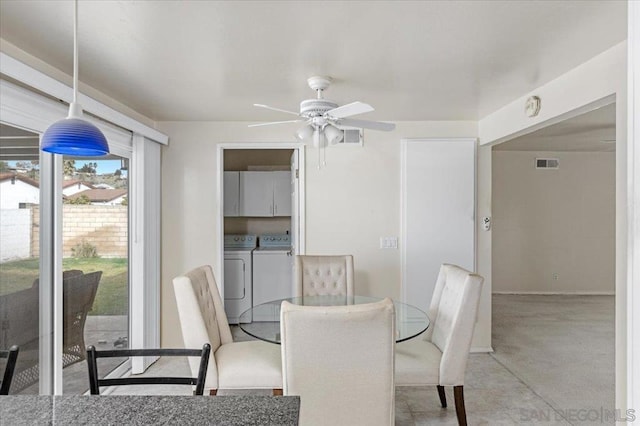 dining room with ceiling fan and separate washer and dryer