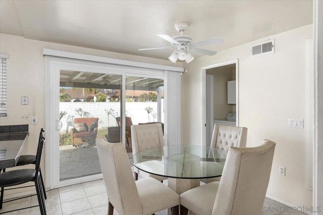 dining room with light tile patterned flooring and ceiling fan