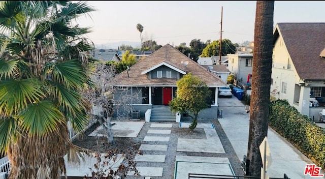 bungalow-style house with a patio area