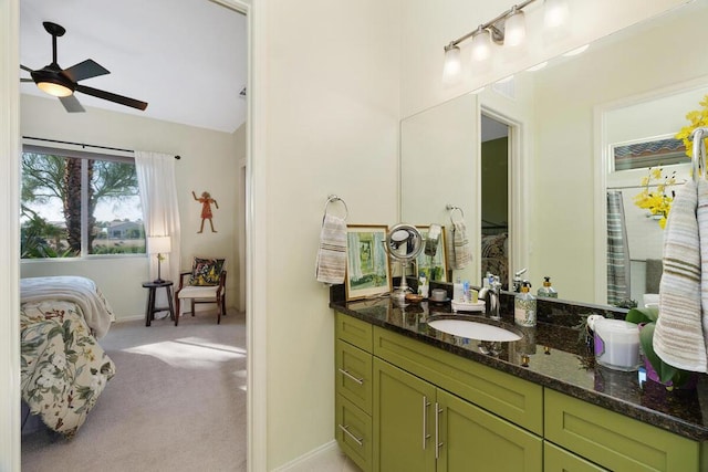 bathroom featuring vanity, vaulted ceiling, and ceiling fan