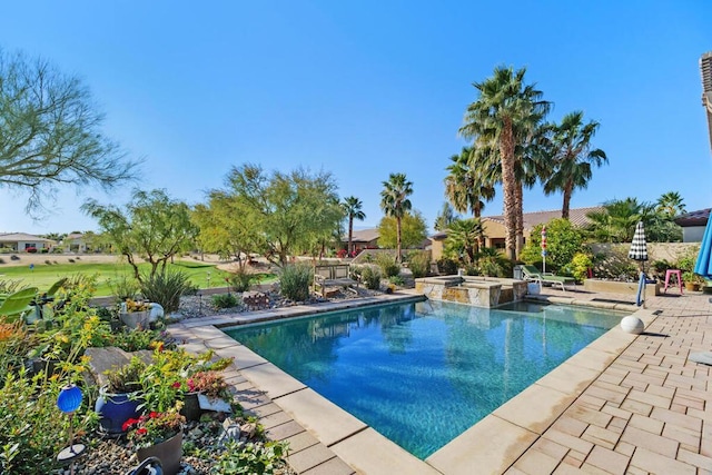 view of swimming pool with a patio area and an in ground hot tub