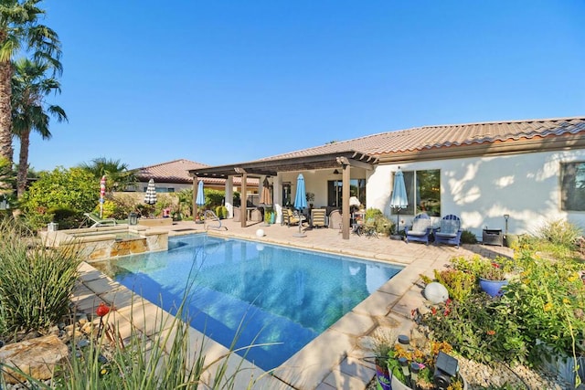 view of pool with a patio and an in ground hot tub