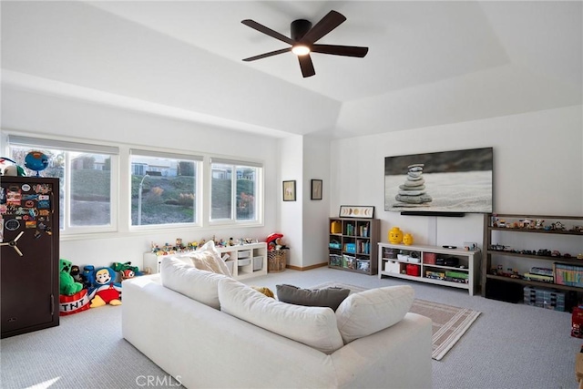 living room featuring ceiling fan and carpet