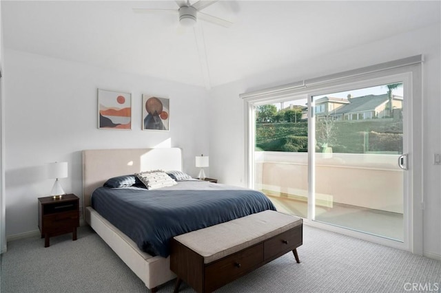 bedroom featuring ceiling fan, light colored carpet, lofted ceiling, and access to exterior