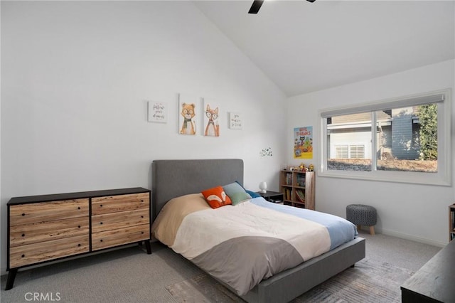 carpeted bedroom featuring ceiling fan and lofted ceiling