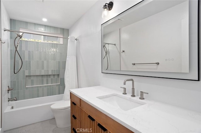 full bathroom featuring shower / bath combo, vanity, and toilet