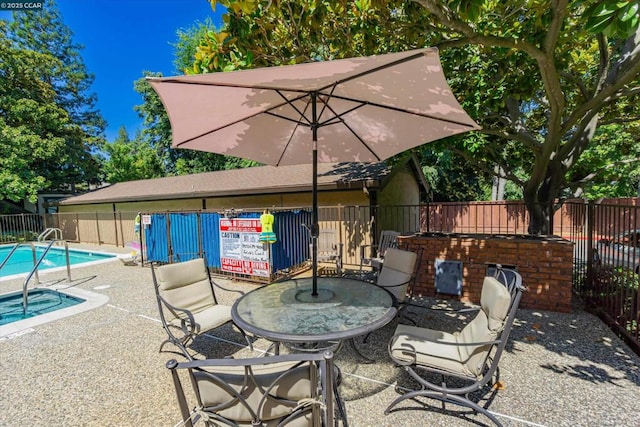 view of patio / terrace featuring a community pool