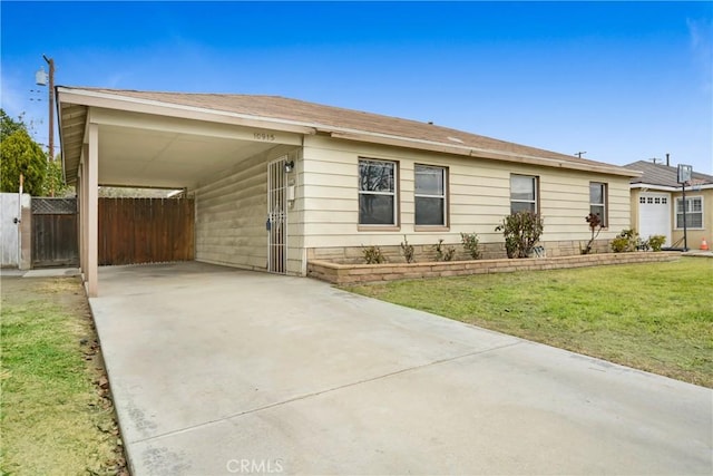 ranch-style home featuring a carport and a front yard