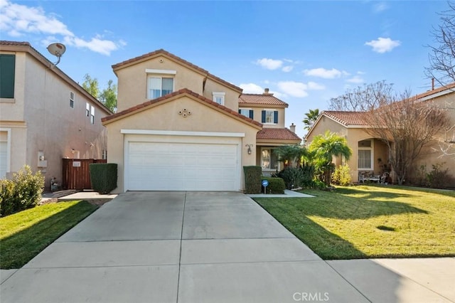 mediterranean / spanish-style home with a garage and a front lawn