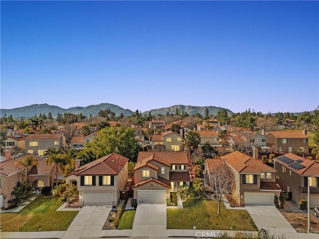 birds eye view of property with a mountain view