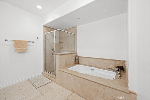 bathroom featuring shower with separate bathtub and tile patterned floors