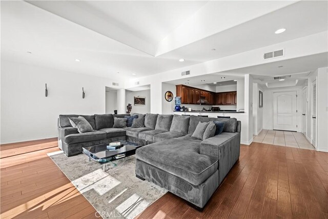 living room with light hardwood / wood-style flooring